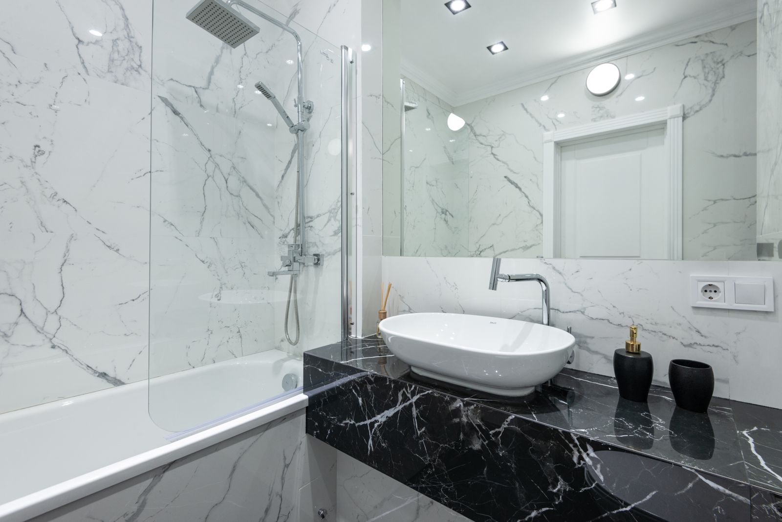 Organized modern bathroom interior with sink and vanity cabinet